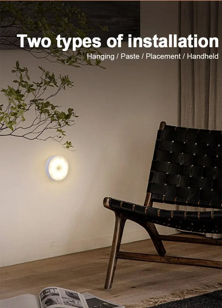 Round LED night light mounted beside an indoor chair